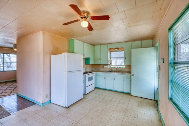 201 Lakewood Dr, Burnet, TX 78611 - kitchen featuring white appliances, a ceiling fan, light countertops, and plenty of natural light