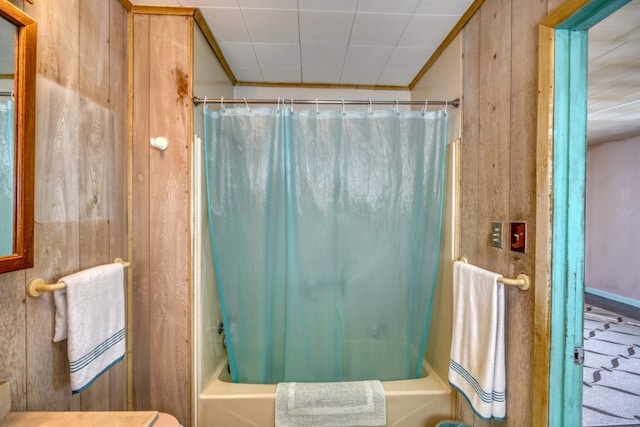 201 Lakewood Dr, Burnet, TX 78611 - full bathroom with shower / bath combo with shower curtain and wooden walls