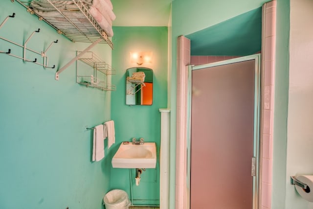201 Lakewood Dr, Burnet, TX 78611 - bathroom featuring a stall shower and a sink