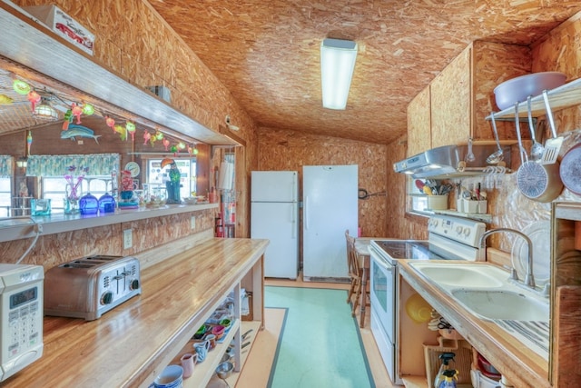 201 Lakewood Dr, Burnet, TX 78611 - kitchen with white appliances, lofted ceiling, extractor fan, and plenty of natural light