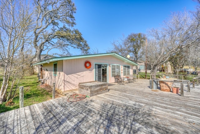 201 Lakewood Dr, Burnet, TX 78611 - wooden terrace with outdoor dining area