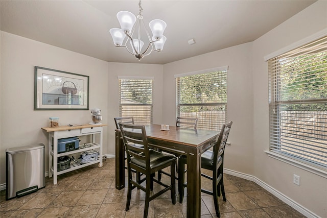 dining room featuring a notable chandelier