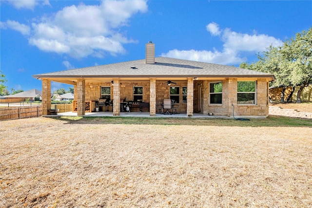 rear view of house with a patio and ceiling fan