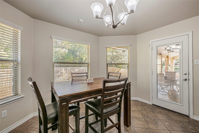 tiled dining area with a notable chandelier