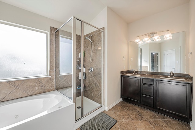 bathroom with vanity and separate shower and tub