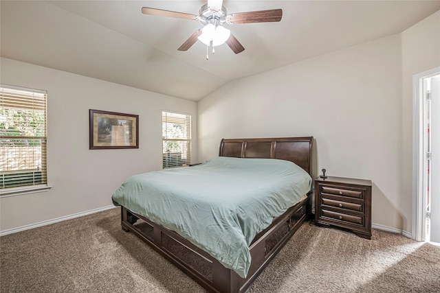 carpeted bedroom with ceiling fan and vaulted ceiling