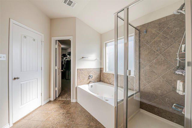 bathroom with plus walk in shower and vaulted ceiling