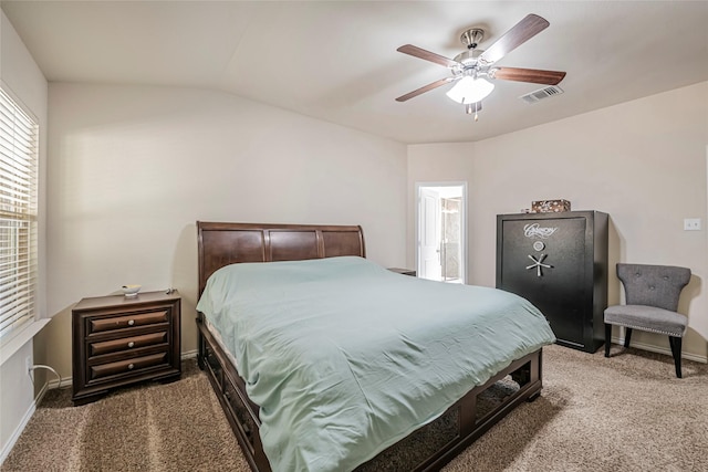 carpeted bedroom featuring lofted ceiling, connected bathroom, and ceiling fan