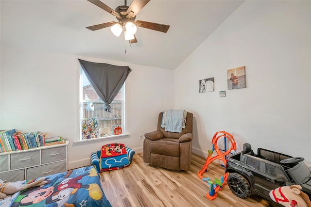 rec room with hardwood / wood-style flooring, ceiling fan, and lofted ceiling