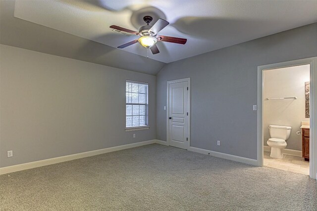 unfurnished bedroom with ceiling fan, light colored carpet, and lofted ceiling