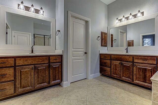 bathroom with vanity and tile patterned floors