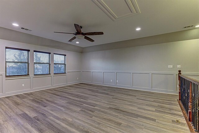 spare room featuring hardwood / wood-style flooring and ceiling fan