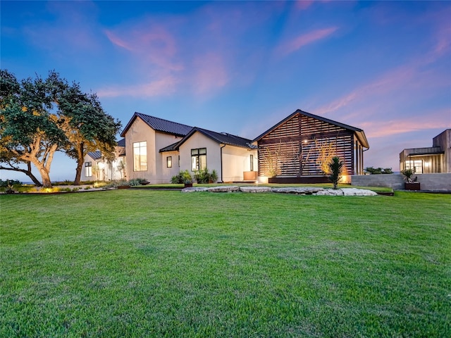 view of front of home featuring a lawn