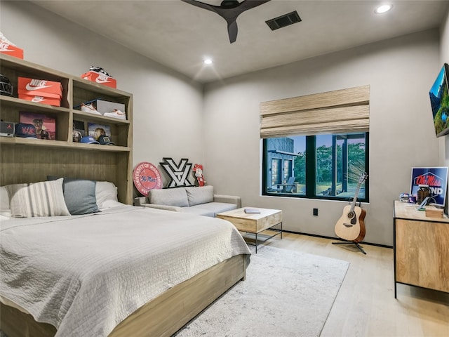 bedroom featuring light hardwood / wood-style floors and ceiling fan