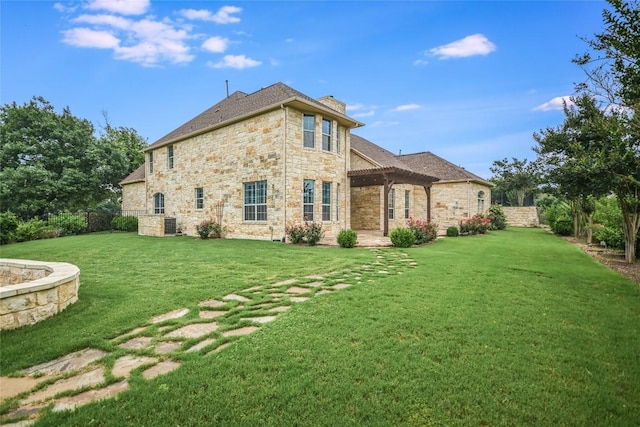 back of property with a pergola, stone siding, and a chimney