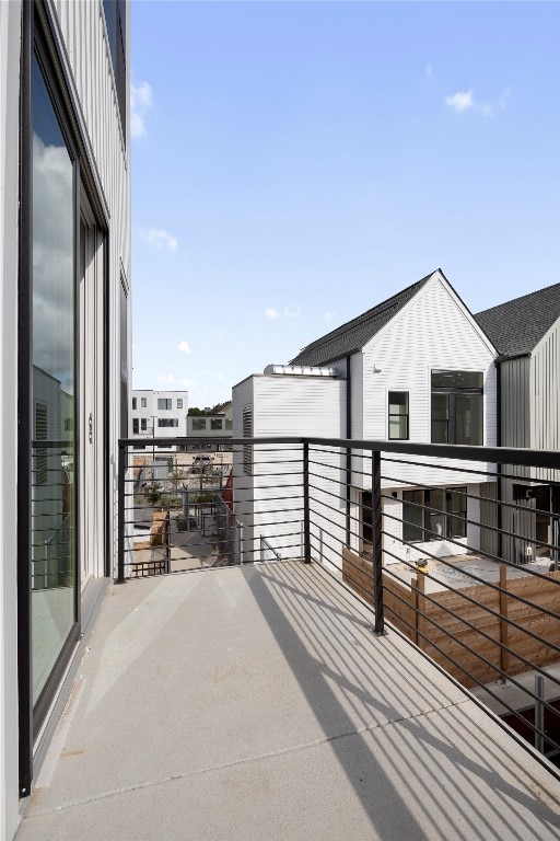 view of patio featuring a balcony