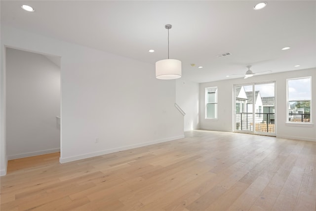 interior space featuring light wood-type flooring and ceiling fan