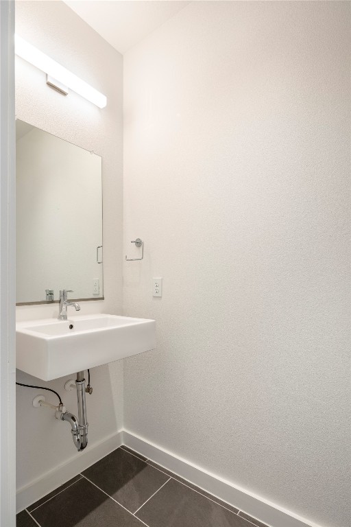 bathroom with tile patterned floors and sink