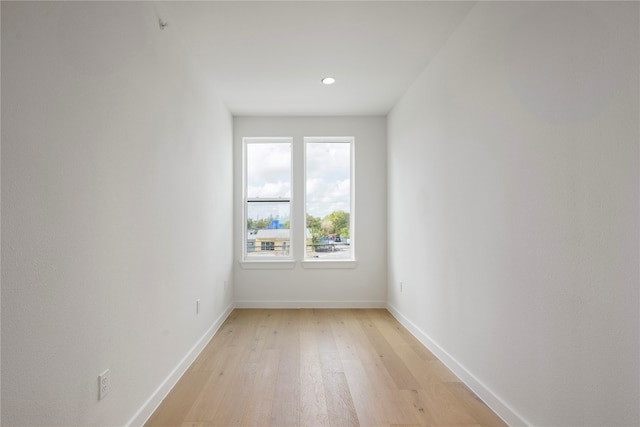 spare room with light wood-type flooring