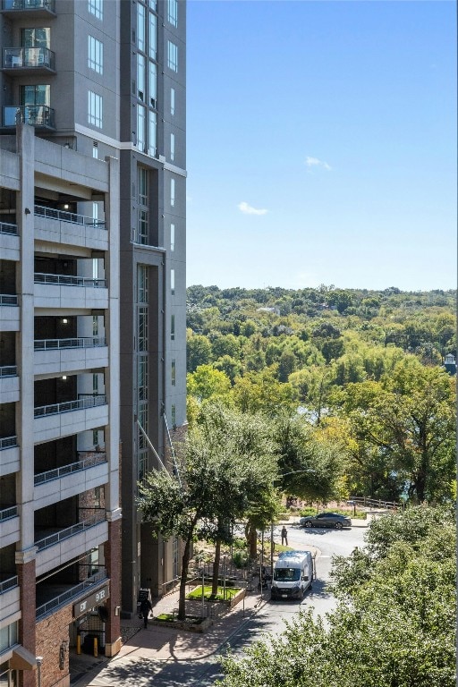 54 Rainey St Unit 613, Austin, TX 78701 - view of building exterior featuring uncovered parking