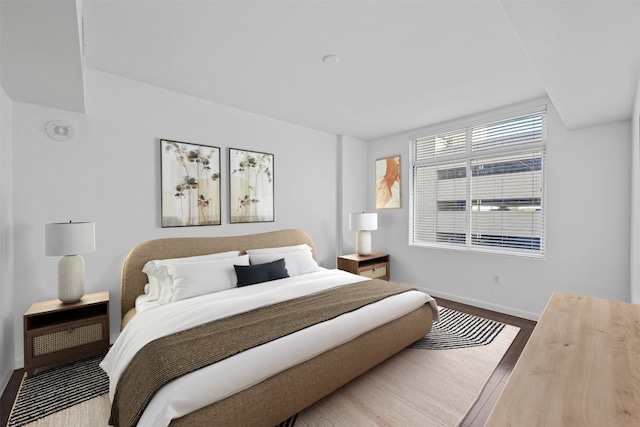 54 Rainey St Unit 613, Austin, TX 78701 - bedroom with baseboards and wood finished floors
