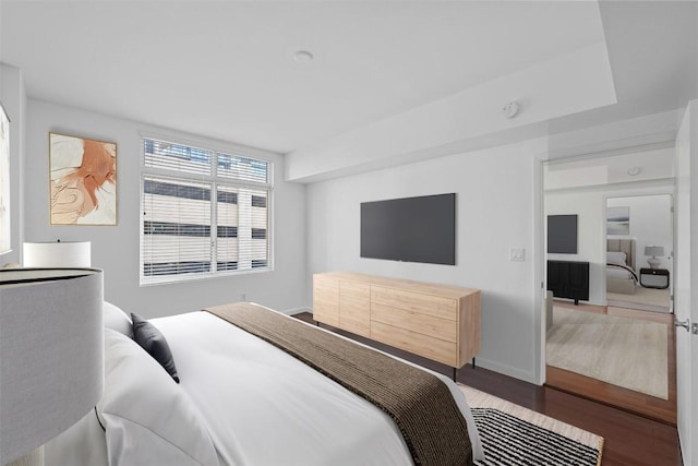 54 Rainey St Unit 613, Austin, TX 78701 - bedroom with wood finished floors and baseboards