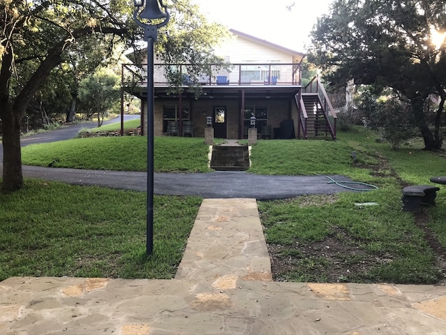 exterior space with a lawn and a wooden deck