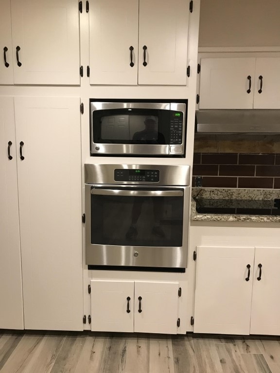 kitchen with white cabinets and stainless steel appliances