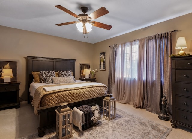 bedroom featuring light colored carpet and ceiling fan