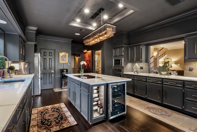 kitchen featuring dark hardwood / wood-style flooring, beverage cooler, and appliances with stainless steel finishes