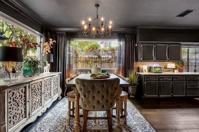 dining space with plenty of natural light, dark wood-type flooring, and a notable chandelier