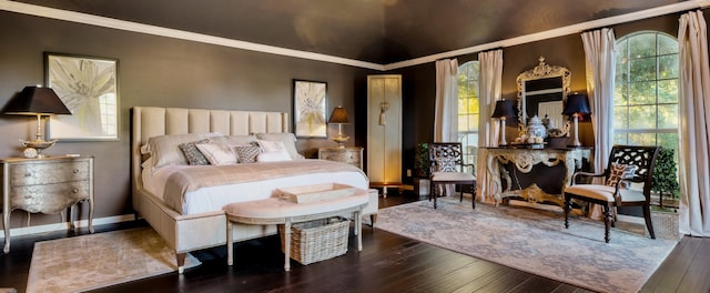 bedroom featuring vaulted ceiling, multiple windows, crown molding, and dark hardwood / wood-style floors