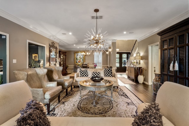 interior space featuring ornamental molding, a chandelier, and hardwood / wood-style flooring