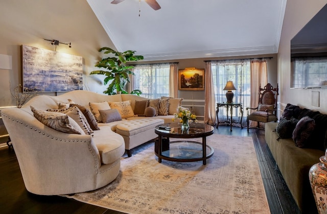 living room featuring vaulted ceiling, crown molding, ceiling fan, and dark wood-type flooring