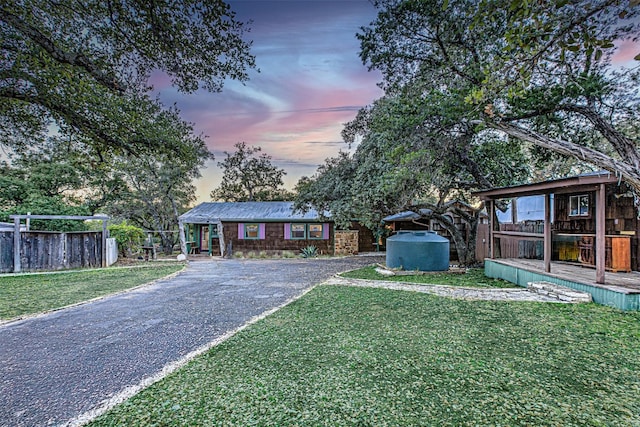 single story home with a yard