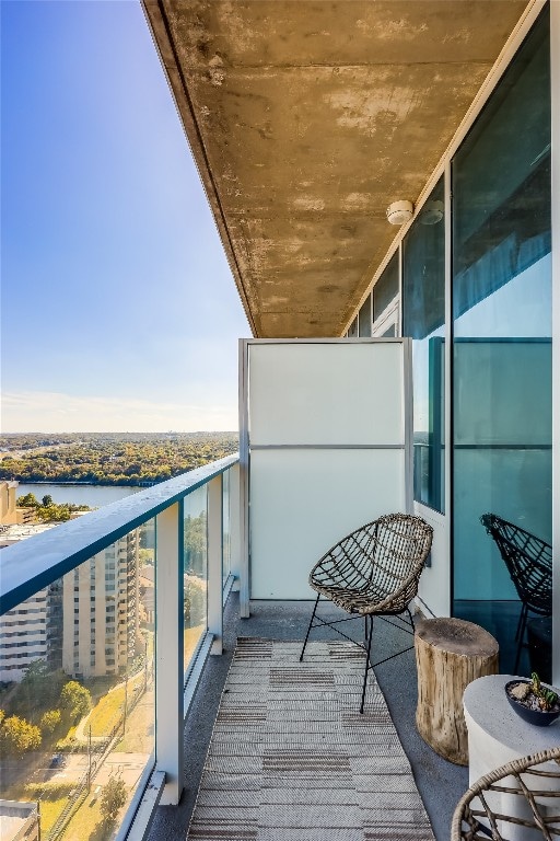 balcony featuring a water view