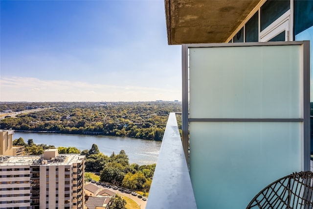 balcony featuring a water view