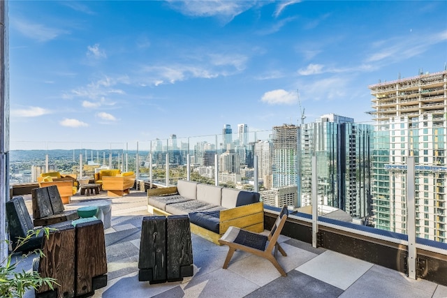 view of patio featuring a balcony and an outdoor hangout area