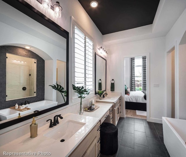 bathroom featuring tile patterned floors, plus walk in shower, and vanity