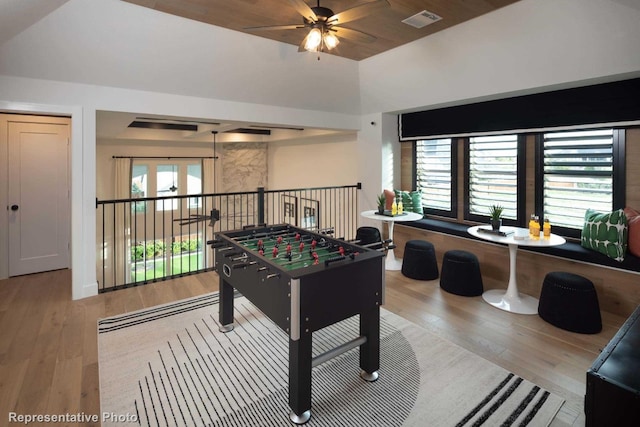 game room featuring hardwood / wood-style flooring, ceiling fan, and lofted ceiling