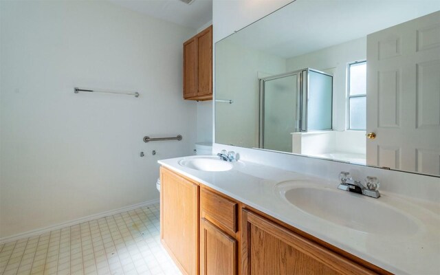 full bathroom with vanity, plus walk in shower, and toilet