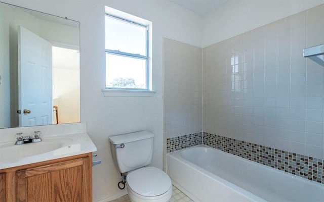 full bathroom featuring tile patterned flooring, vanity, toilet, and tiled shower / bath