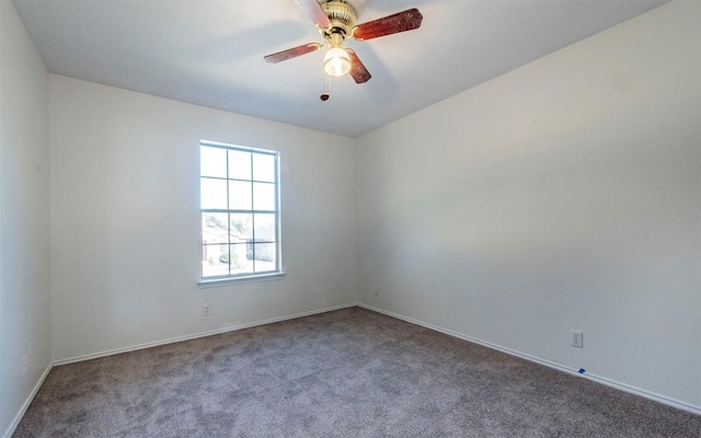 spare room with carpet flooring and ceiling fan