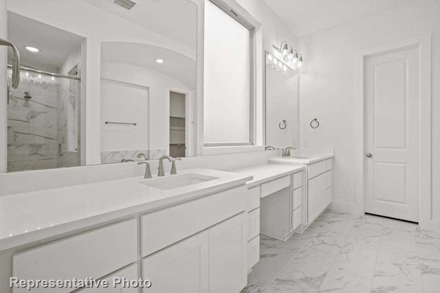 bathroom with vanity and an enclosed shower