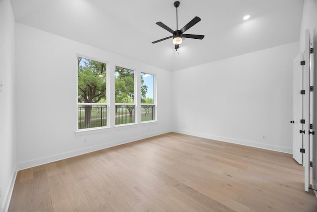 unfurnished room featuring light wood-style floors, ceiling fan, vaulted ceiling, recessed lighting, and baseboards