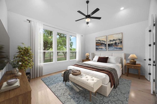 bedroom with recessed lighting, light wood-style flooring, vaulted ceiling, and a ceiling fan