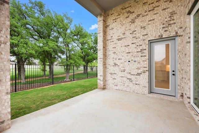 view of patio / terrace featuring fence