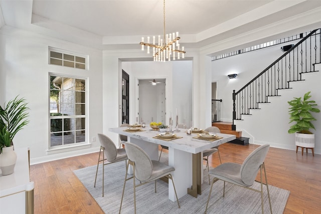 dining area featuring a chandelier and light hardwood / wood-style flooring