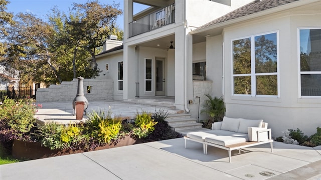 view of patio featuring a balcony