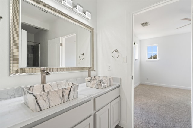 bathroom featuring vanity and ceiling fan